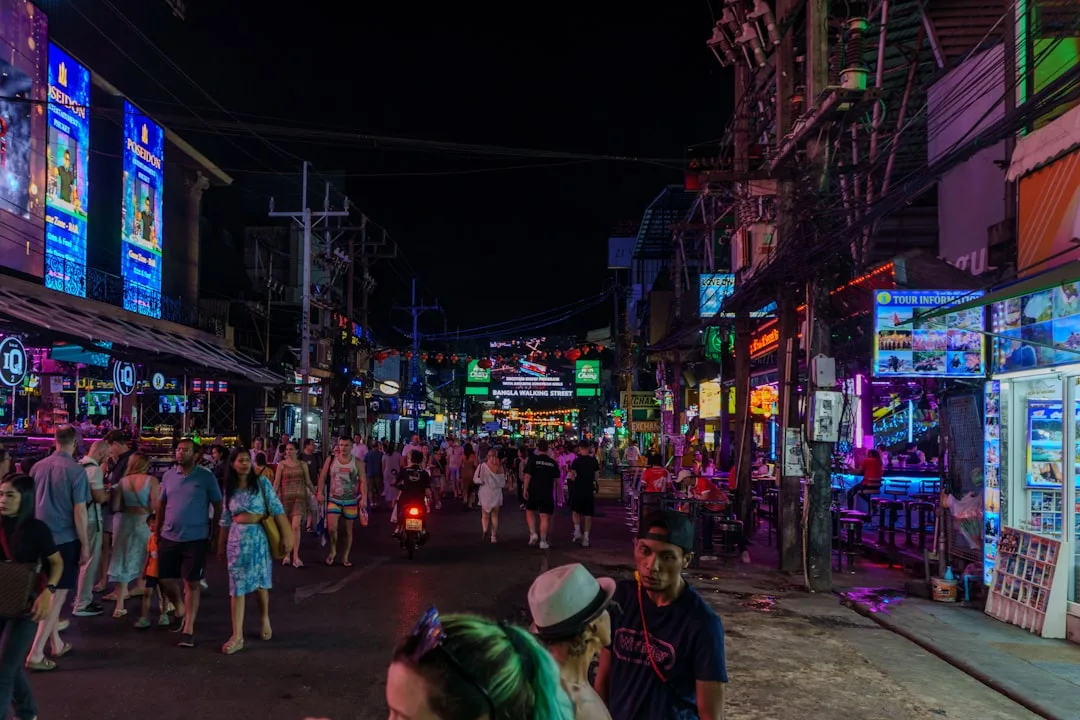 Bangla Road Phuket at night: neon-lit walking street in Patong packed with crowds and entertainment venues