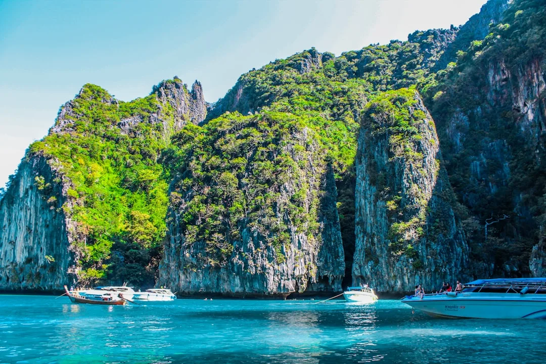 Phi Phi Islands limestone karsts rising from turquoise Andaman Sea waters on a clear day